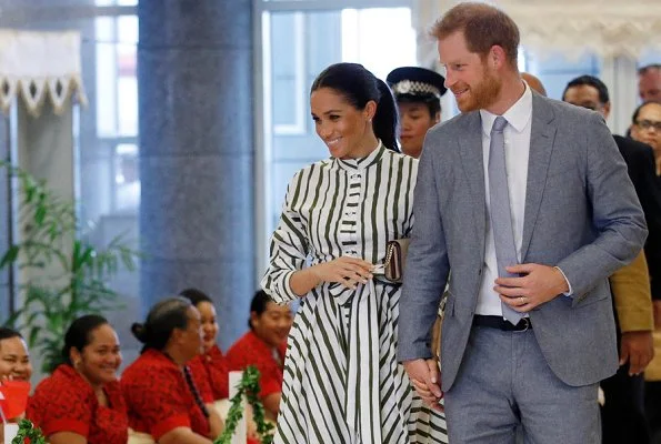 Meghan Markle wore Martin Grant Striped Shirt Dress from Spring Summer 2019 Collection, Prada Biblioteque clutch, Birks Quartz silver earrings.