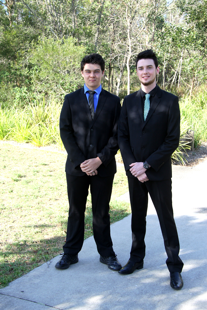 an photo of Aaron with his best mate, Travis, wearing formal suits, at the local wetlands