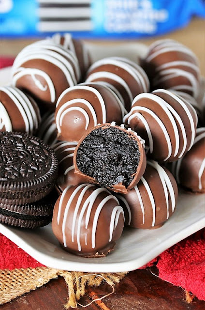 Plate of Classic Oreo Balls with One Cut in Half to Show Inside Image