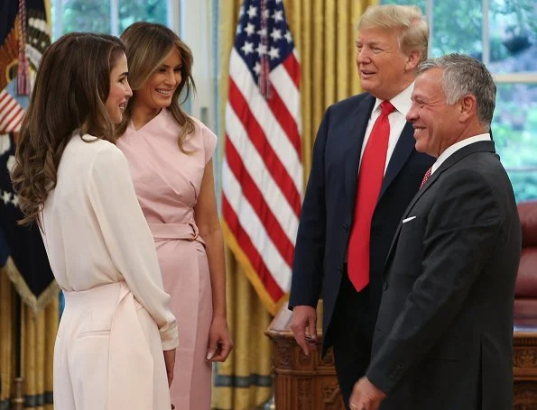 Queen Rania wore a baby pink jumpsuit by Adeam. First Lady Melania Trump wore a pink sleeveless wrap around dress by Proenza Schouler