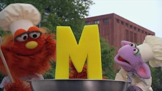 The letter of day is M, Murray and Ovejita Alphabet Cookoff, Sesame Street Episode 4312 Elmo and Zoe's Hat Contest season 43