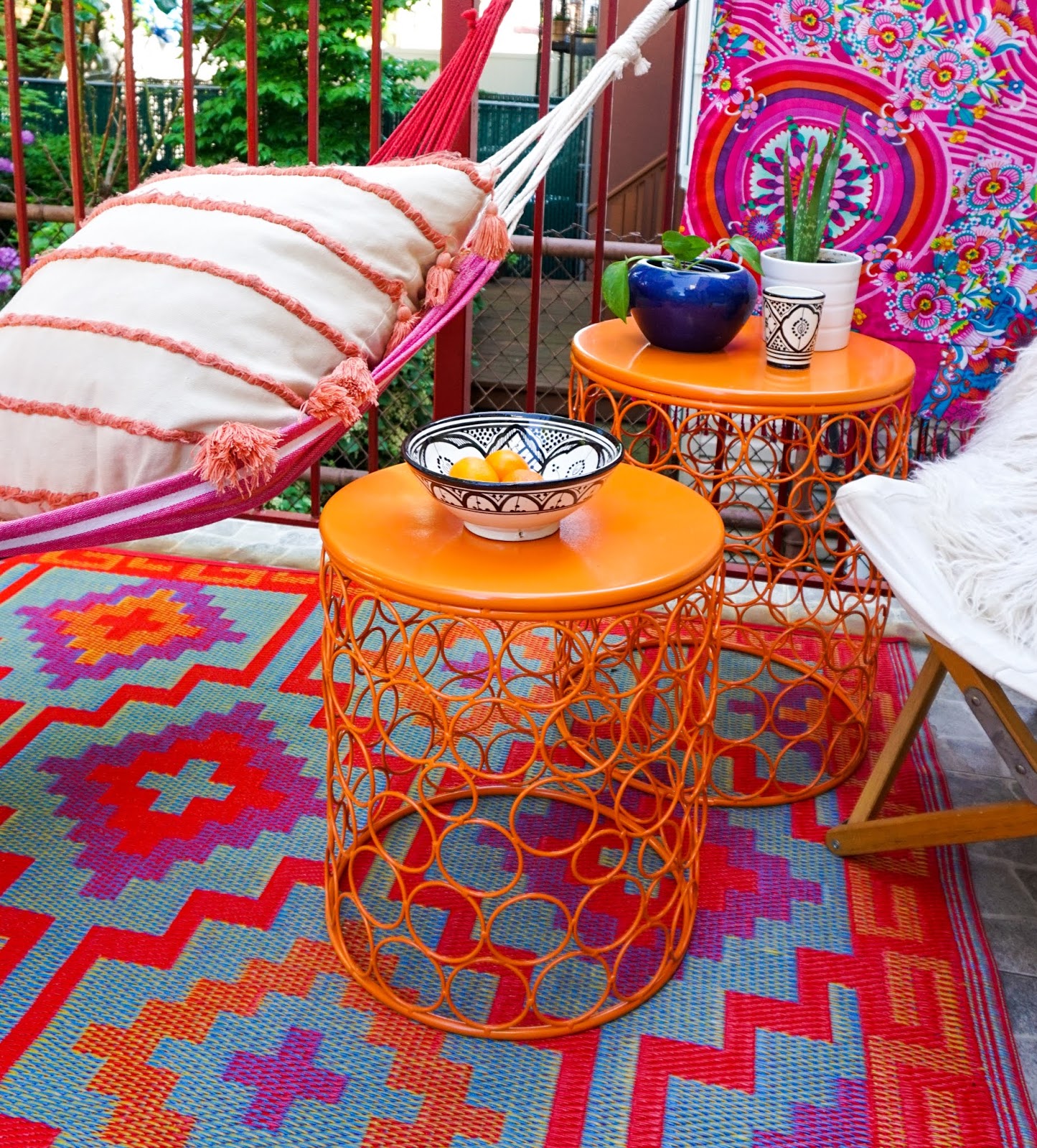 Bohemian Outdoor Space, bright bohemian patio, small outdoor space Inspiration, bohemian outdoor space inspo, colorful outdoor spaces, colorful outdoor space ideas, boho outdoor spaces, outdoor spaces hammocks, small  outdoor space with hammock, hammock outdoor spaces, colorful patio ideas, boho backyard ideas, colorful bohemian outdoor spaces, sustainable outdoor rugs, recycled plastic outdoor rugs, Wayfair outdoor furniture , sustainable outdoor furniture 