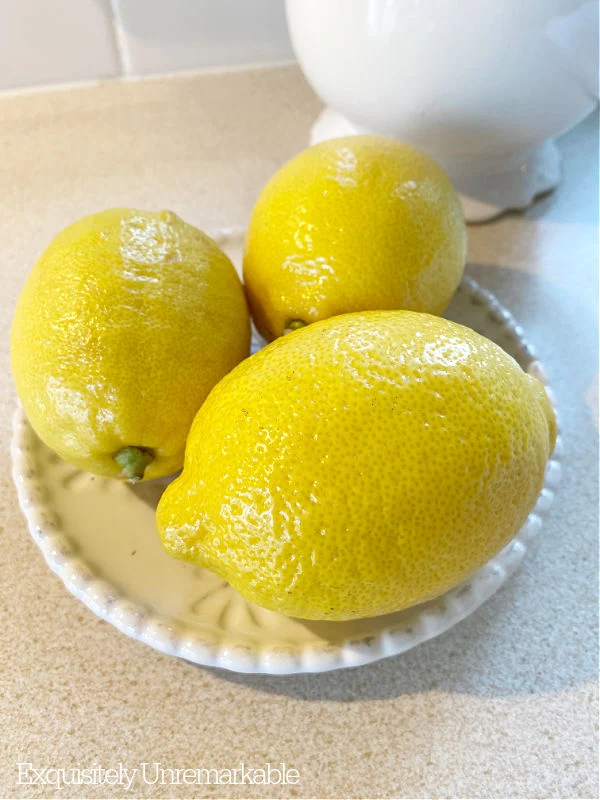 Three Lemons On A Dish