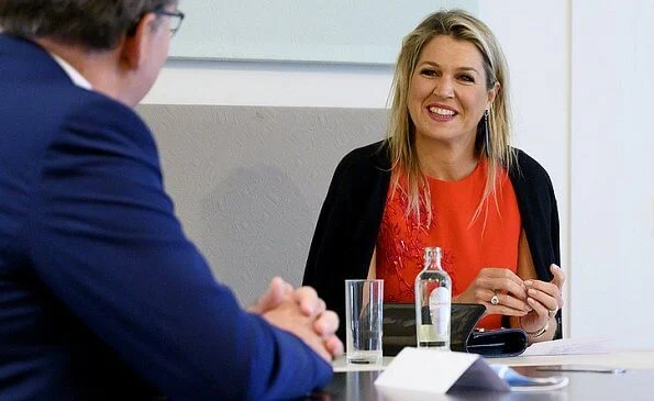 Queen Maxima wore a short sleeve red midi dress from Natan Edouard Vermeulen Fall-Winter 2016 collection