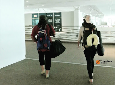 Stepheny Siew the lifestyle blogger with her female friend walking towards the departure gate in KLIA 2 the Malaysia's internationl airport
