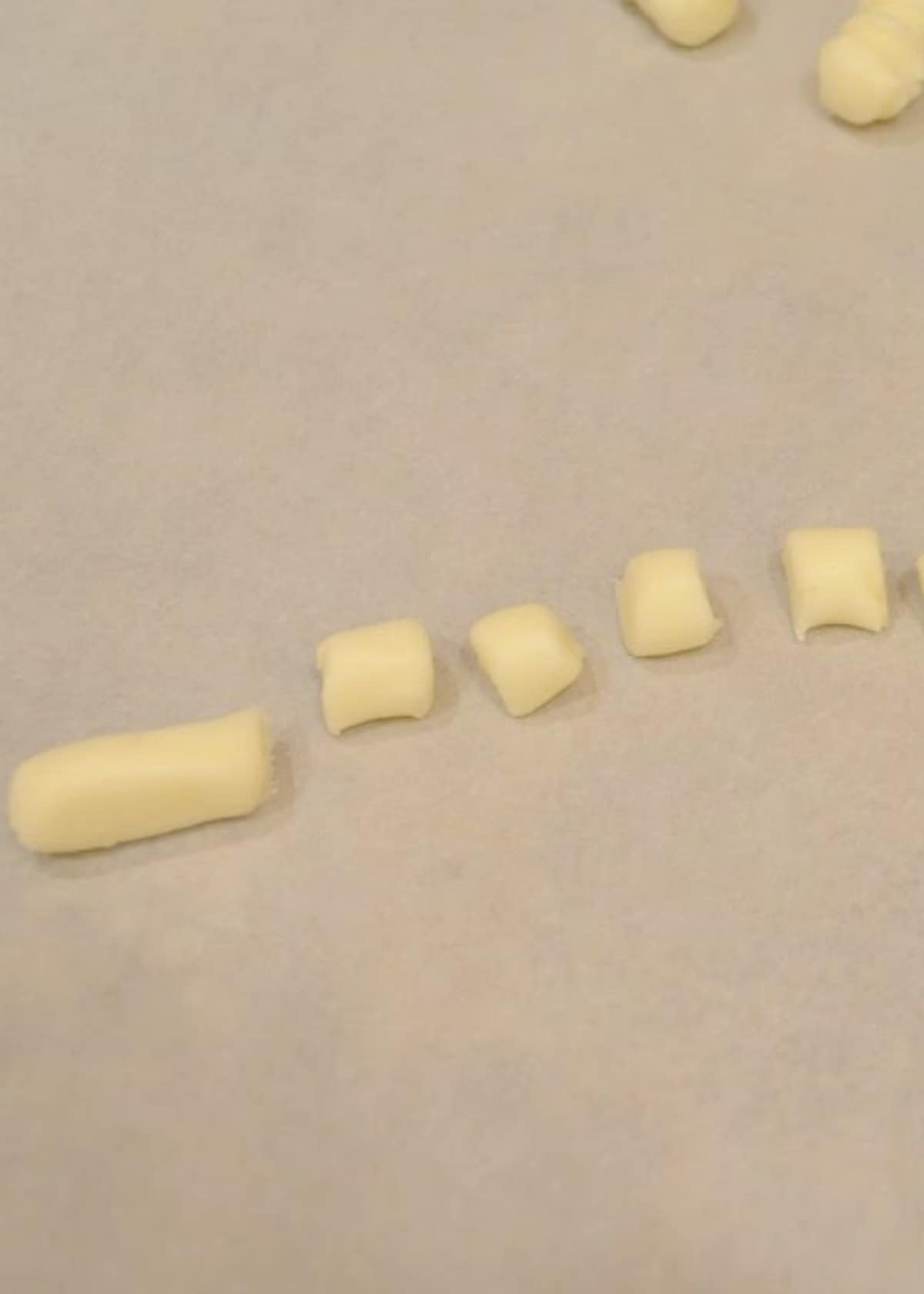 Sliced Buttermints on a piece of parchment paper.