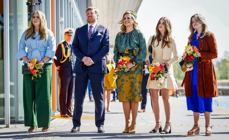 Princess Alexia wore a beige knit cardigan and dress by Maje. Amalia wore a blouse by Natan. Maxima wore a silk skirt and top by Natan