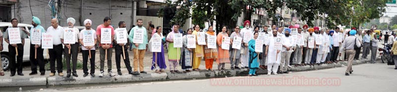 Members of Ludhiana First Club making human chain to create traffic rules awareness