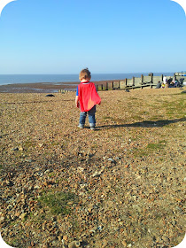 toddler exploring, whitstable beach, toddler pebbles