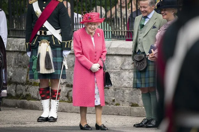 The Queen wore a raspberry pink coat and a matching hat, with a floral dress