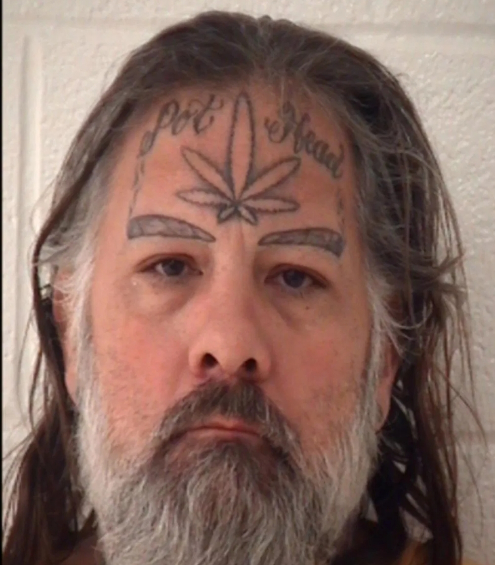 Words Worth Warrant Out For Man With Pot Head Tattoo