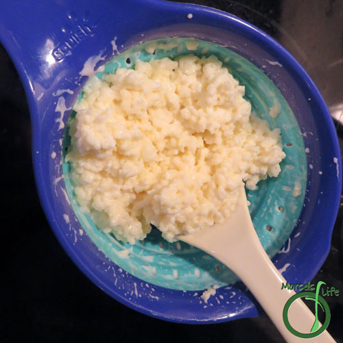 Morsels of Life - Kefir Step 4 - Pour the jar into a strainer. I like to press on the kefir grains a bit to get more kefir out. After straining, I will return the kefir grains to the jar and add more milk.