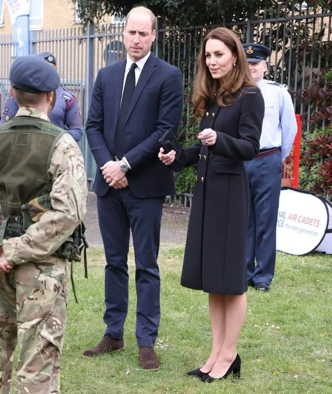 Kate Middleton wore a collarless long coat from Dolce & Gabbana, and suede pumps from Tod's. She carried Mulberry Bayswater clutch