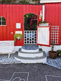 Open red door in Innlandet Kristiansund Norway