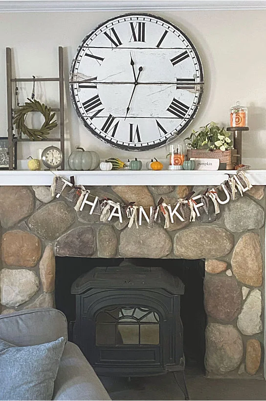 thanksgiving mantel with thankful banner