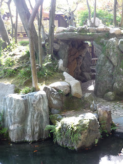 Rock tunnel and park of a stream at the Sorakuen gardens, Kobe