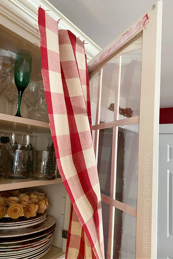 Flopping Cabinet Fabric on a glass cabinet door