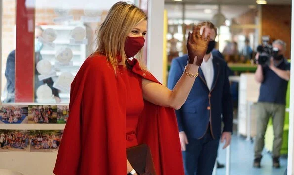 Queen Maxima wore a red coat and red sleeveless dress from Natan. Oscar de la Renta earrings