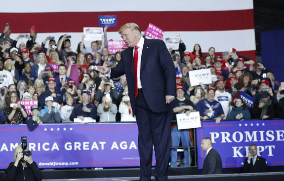 Trump takes aim at familiar targets at Michigan rally
