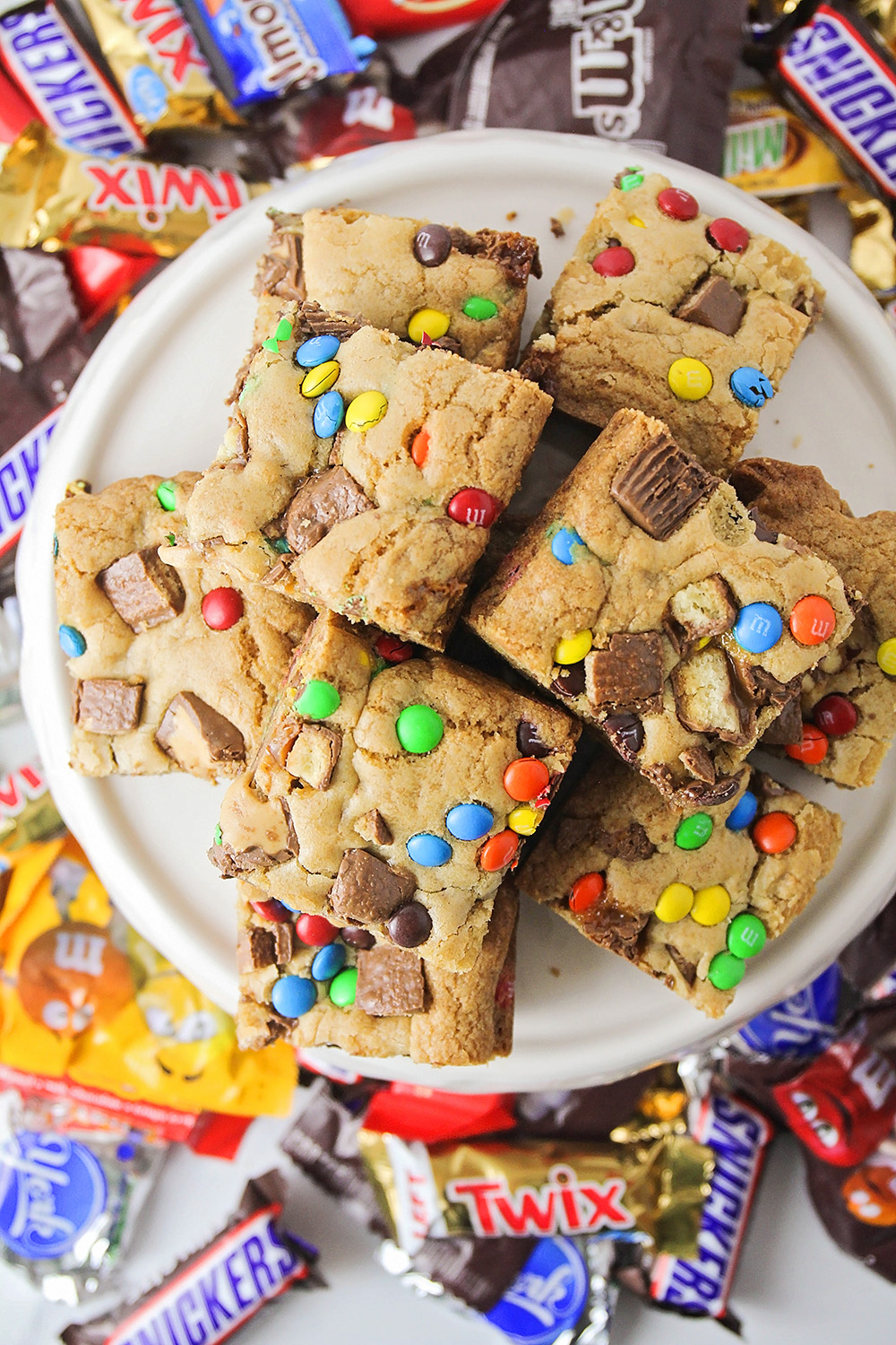 These candy bar blondies are so delicious and indulgent, and loaded with all of your favorite treats!