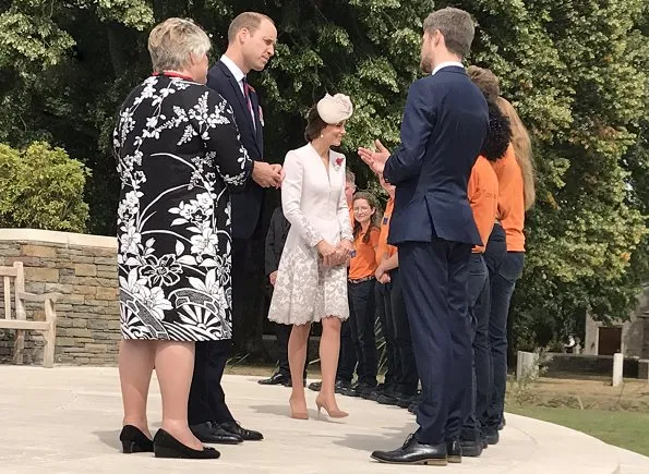 Kate Middleton wore Catherine Walker dress. Queen Mathilde wore Natan Dress. Prince Charles, Prince William and Catherine, Duchess of Cambridge