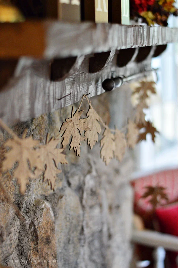 Wooden Leaf Banner On Mantel