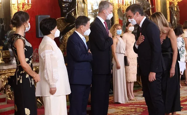 Queen Letizia wore a sequin embellished metallic floral print jacquard midi dress from Dries van Noten. First Lady Kim Jung-sook