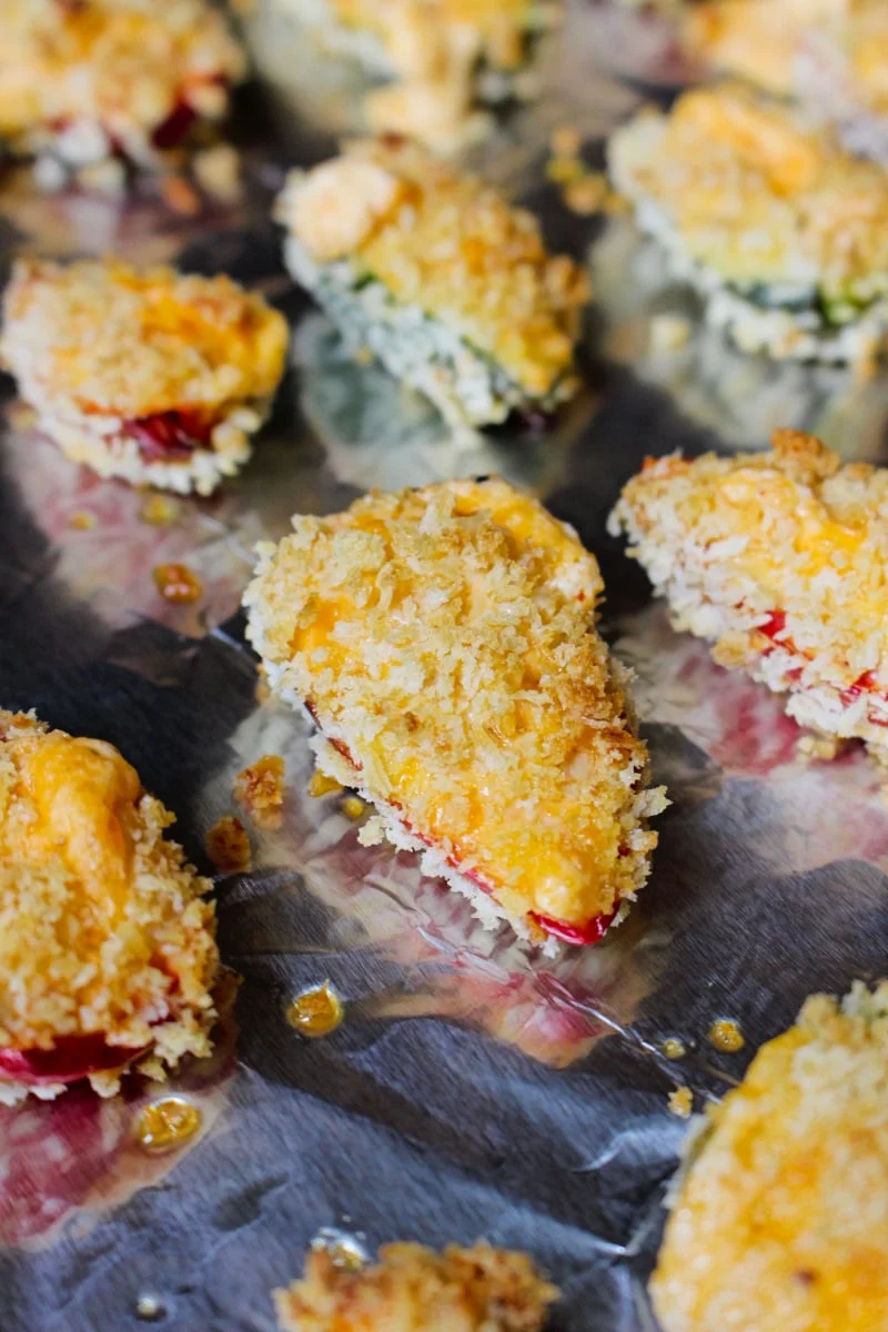 Baked Jalapeño Poppers are a healthier version of fried jalapeño poppers! Fresh stuffed jalapenos are rolled in panko breadcrumbs and baked in the oven until the outside is golden and crispy and the inside is melty and cheesy. #appetizer #jalapenos
