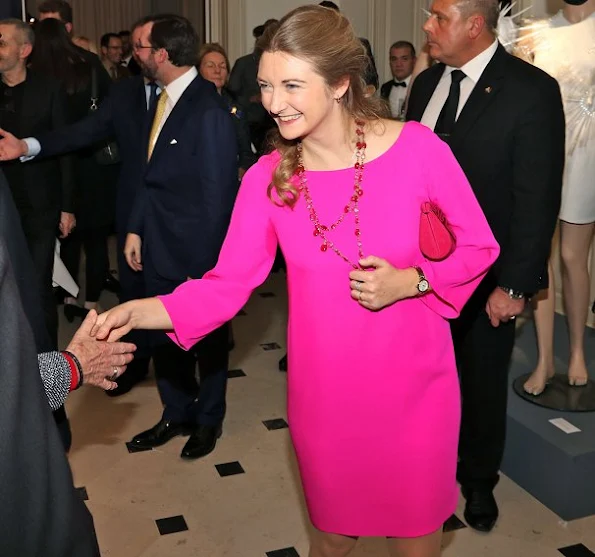 Princess Stephanie wore a fuchsia color Prada Dress, Prada Bordeaux Coloured suede shoes, Prada Bordeaux Coloured clutch bag and Colored stone ruby necklace and ruby ring