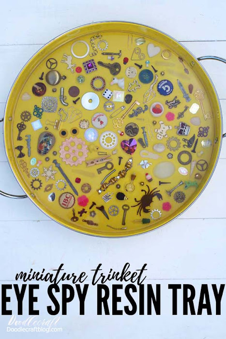 This I spy game resin serving tray filled with miniatures and trinkets is a fun DIY and would make a great gift! Fill the tray with little things from the junk drawer or little heirlooms that sit in a jewelry box collecting dust. With a thick layer of glossy resin, the trinkets stay in place and offer a smooth surface for using the tray for serving or a coffee table catch all. 