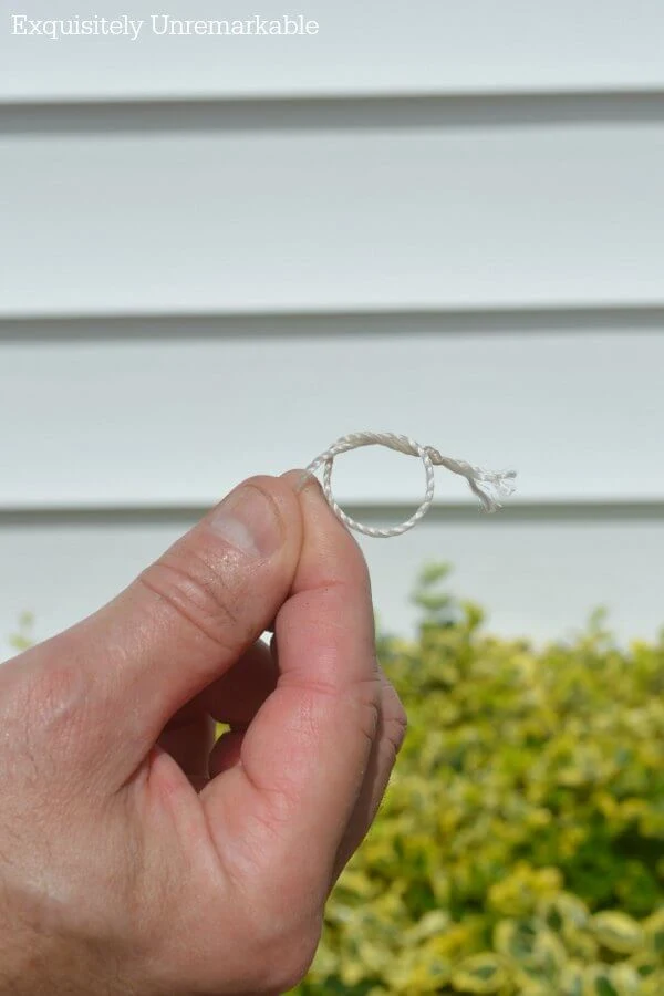 Hand holding twine loop