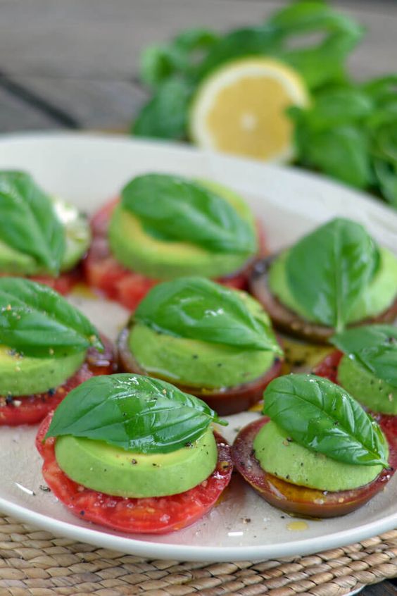 Avocado Caprese salad is paleo take on a Caprese salad with heirloom tomatoes and fresh basil. This salad is paleo, keto, Whole30, vegan, dairy-free, and gluten-free. #cookeatpaleo #veganrecipes #lowcarb #avocado