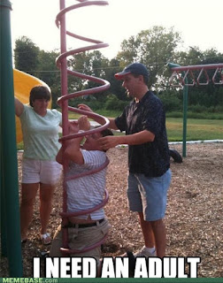 adult stuck in playground apparatus curly ladder