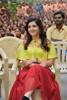 Mehreen Kaur in Spicy Loose Yellow Shirt and Lovely Red Transparent Skirt at Jaawan Movie Promotions at College