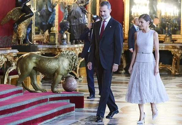 Queen Letizia wore Felipe Varela coat and dress. Crown Princess Leonor and Infanta Sofia attended National Day 2018 parade held at Plaza de Lima