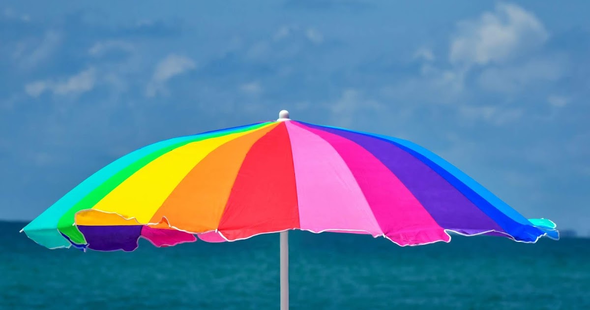 Rainbow Umbrella At Beach