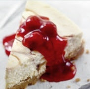 Wadge of cherry almond cake served with Cherry compote Wadge of cherry almond cake served with Cherry compote