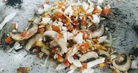 Sauteing mushroom with chicken pieces for hot and sour chicken soup recipe