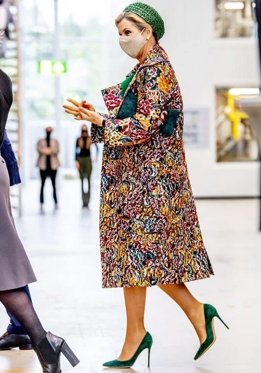 Queen Maxima wore a long floral brocade coat from Oscar de la Renta. and new green dress from Natan