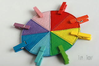 Felt color wheel with wooden clothespins and colorful trinkets handmade by TomToy