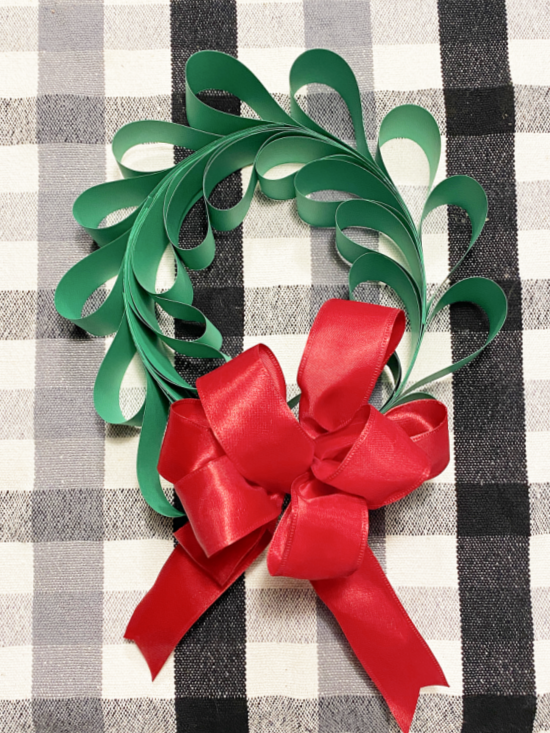 green wreath with red bow