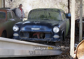 Ron Kidd watches his dream car head up the ramp.