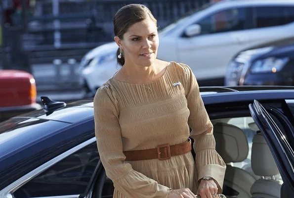 Crown Princess Mary wore Designers Remix Dress. Crown Princess Victoria wore a long cuff sleeve midi dress in beige