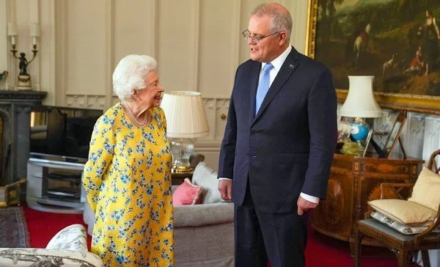 Queen Elizabeth wore a yellow and blue floral dress from  Stewart Parvin. The Queen opted to wear her Jardine Star Brooch