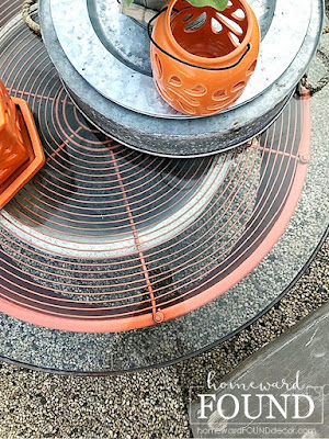 fall, outdoor decor, outdoor fall decor, salvaged, upcycled, repurposed, junk makeover, industrial style, trash to treasure, orange accent color, firepit area decor, backyard decor,  use what you have decorating, farmhouse style, DIY, DIY decorating, DIY project, salvaged metal industrial fan becomes outdoor table