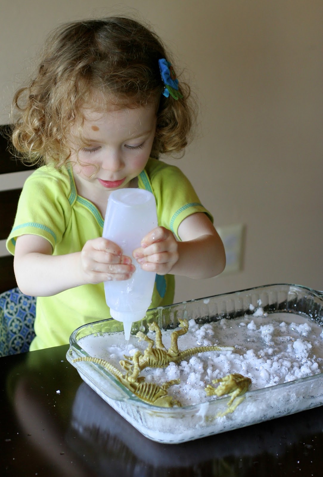 Frozen Sensory Snow - Easy, cheap (cost around one dollar!), and the icy cold lasted for TWO hours while we played!  Perfect for keeping cool this summer from Fun at Home with Kids