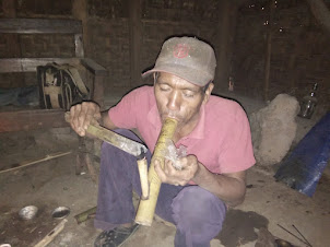 Smoking opium in Longwa village of Nagaland.