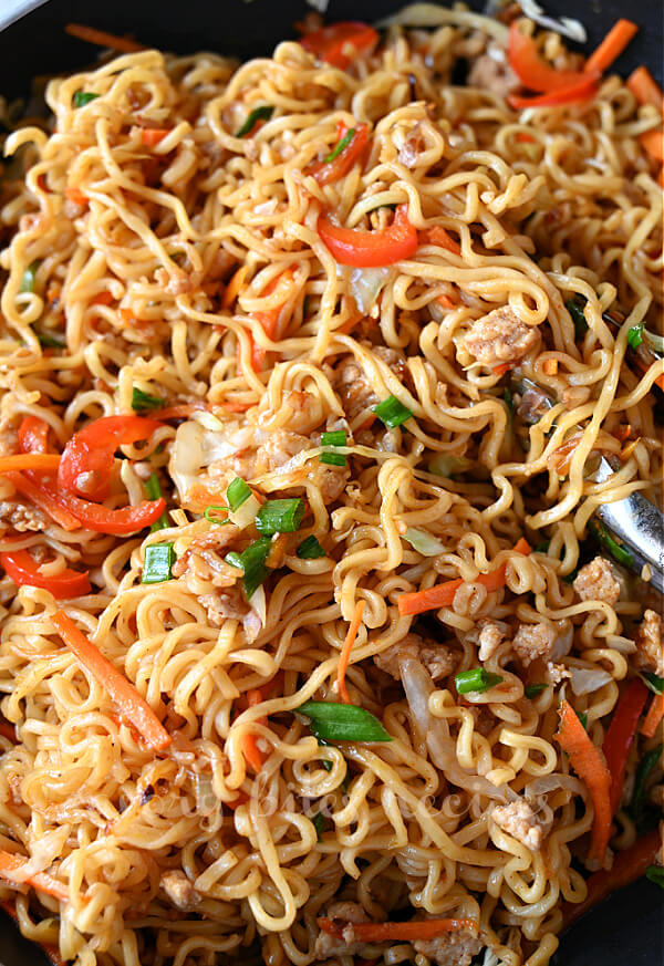 close up of a pan with egg roll ramen