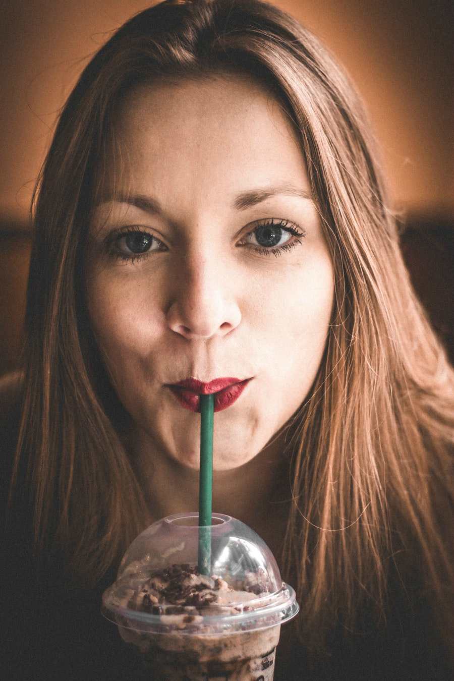 woman-with-straw-on-lips