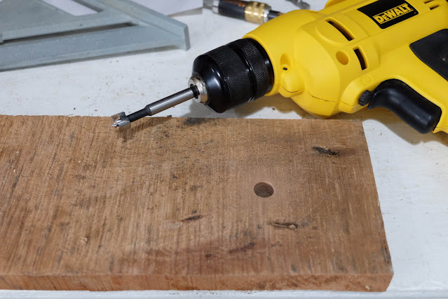 drilling hole with Forstner bit for wine glass